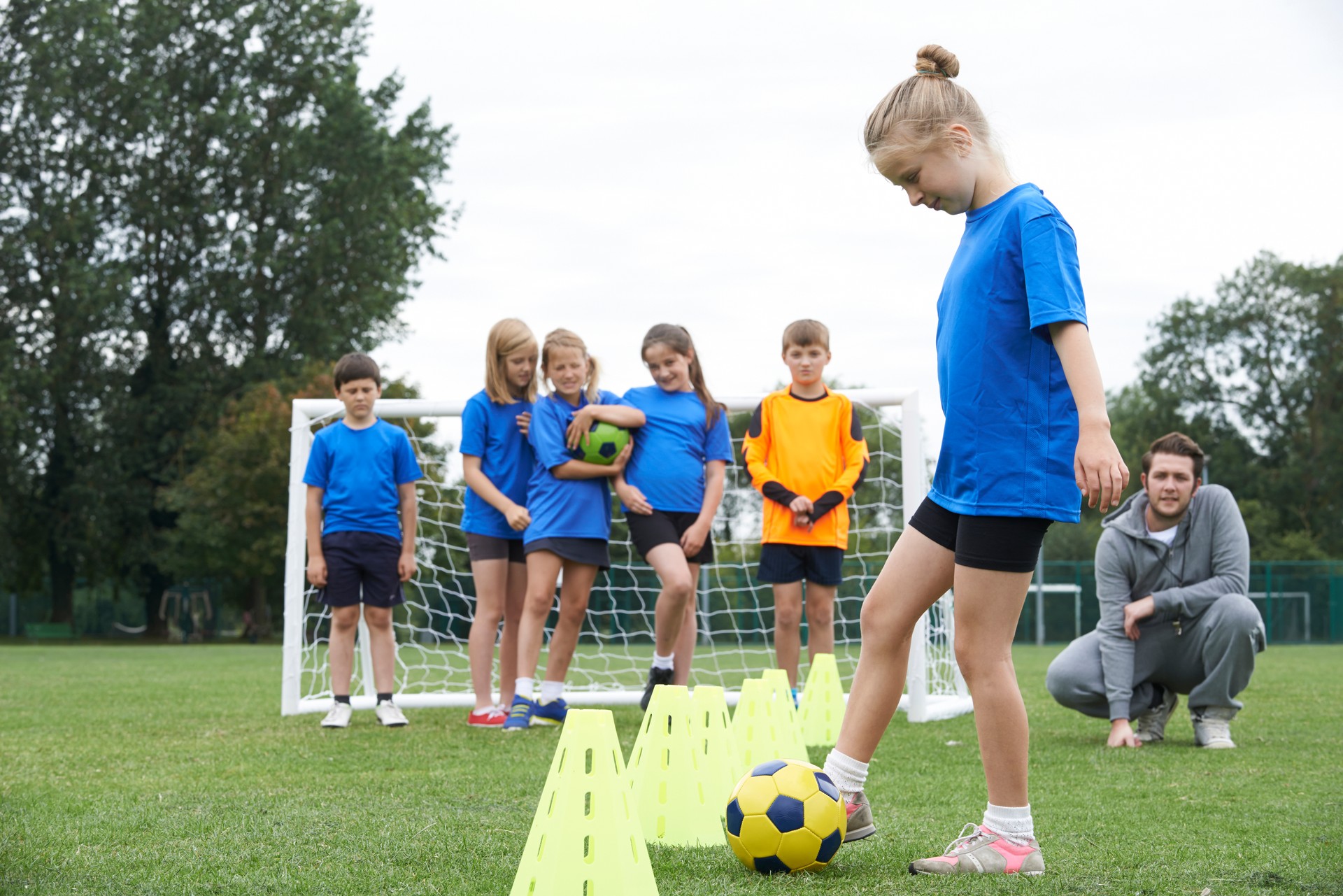 Coach Leading Outdoor Soccer Training Session